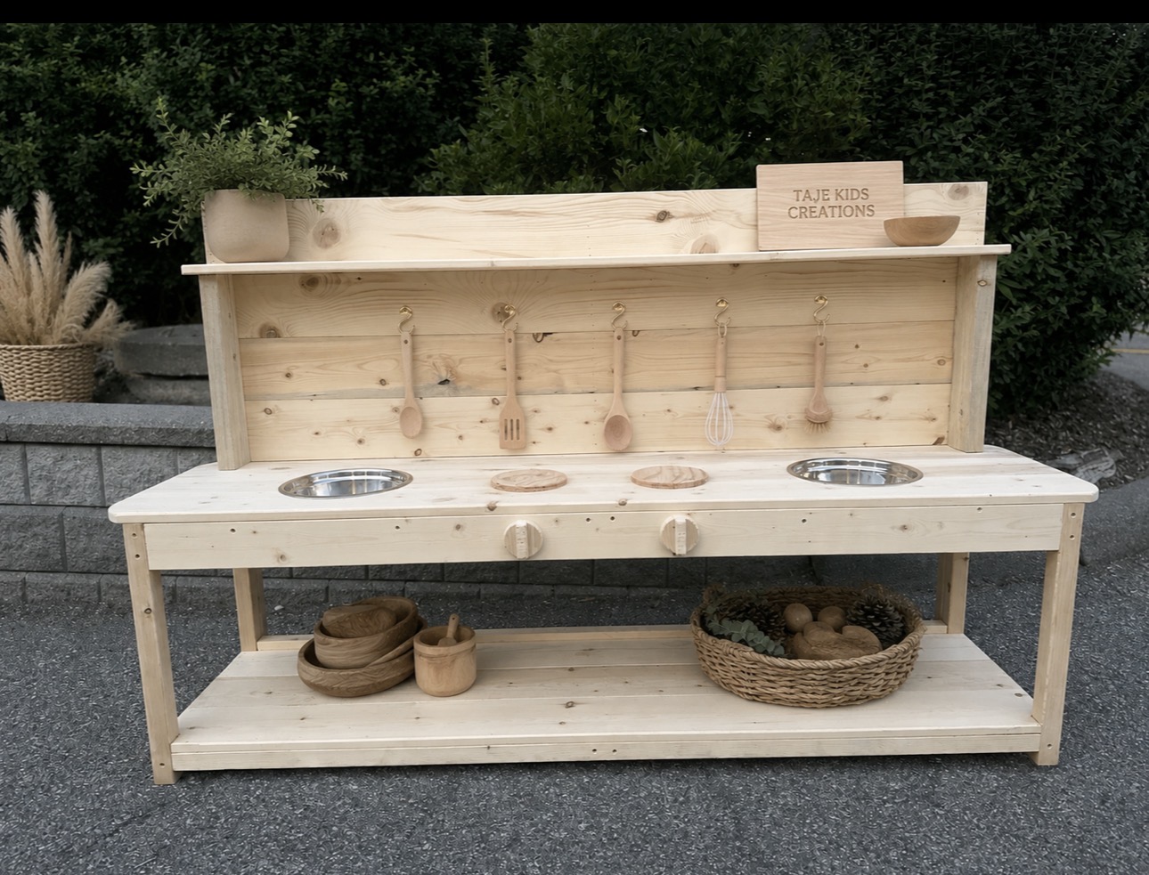 Long natural pine mud kitchen for group play at a daycare