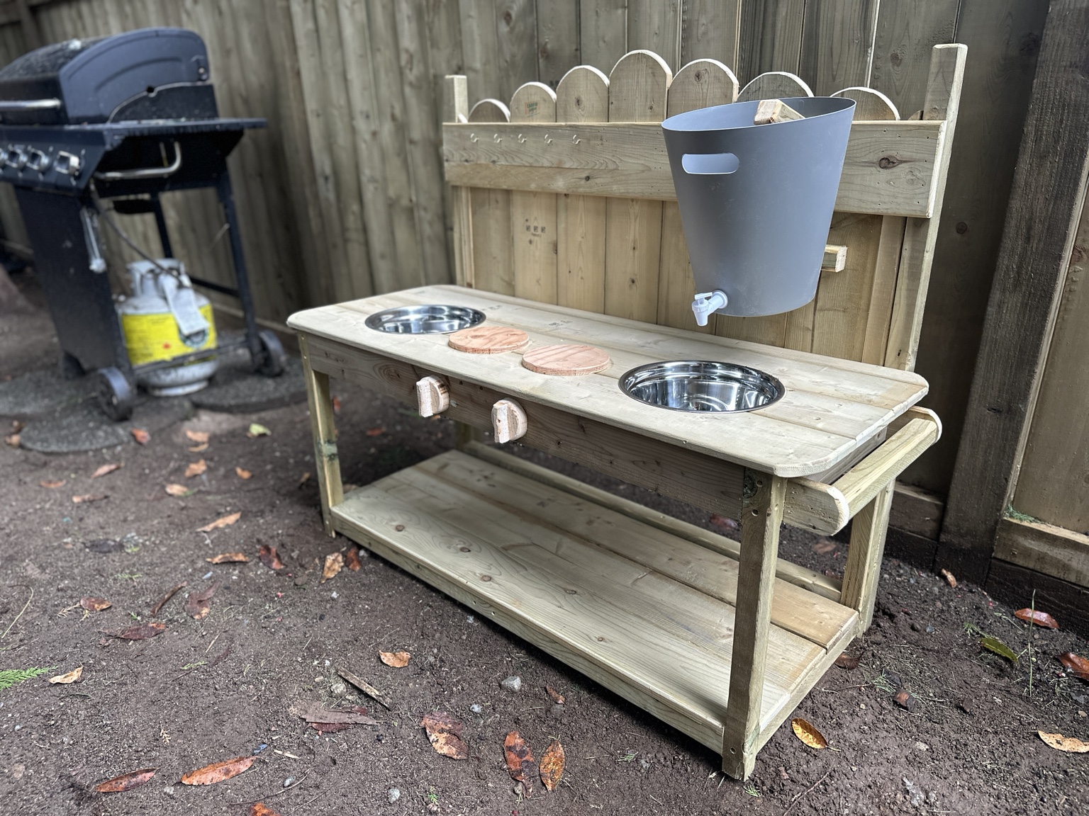 Pressure-treated outdoor mud kitchen with two bowls and water dispenser